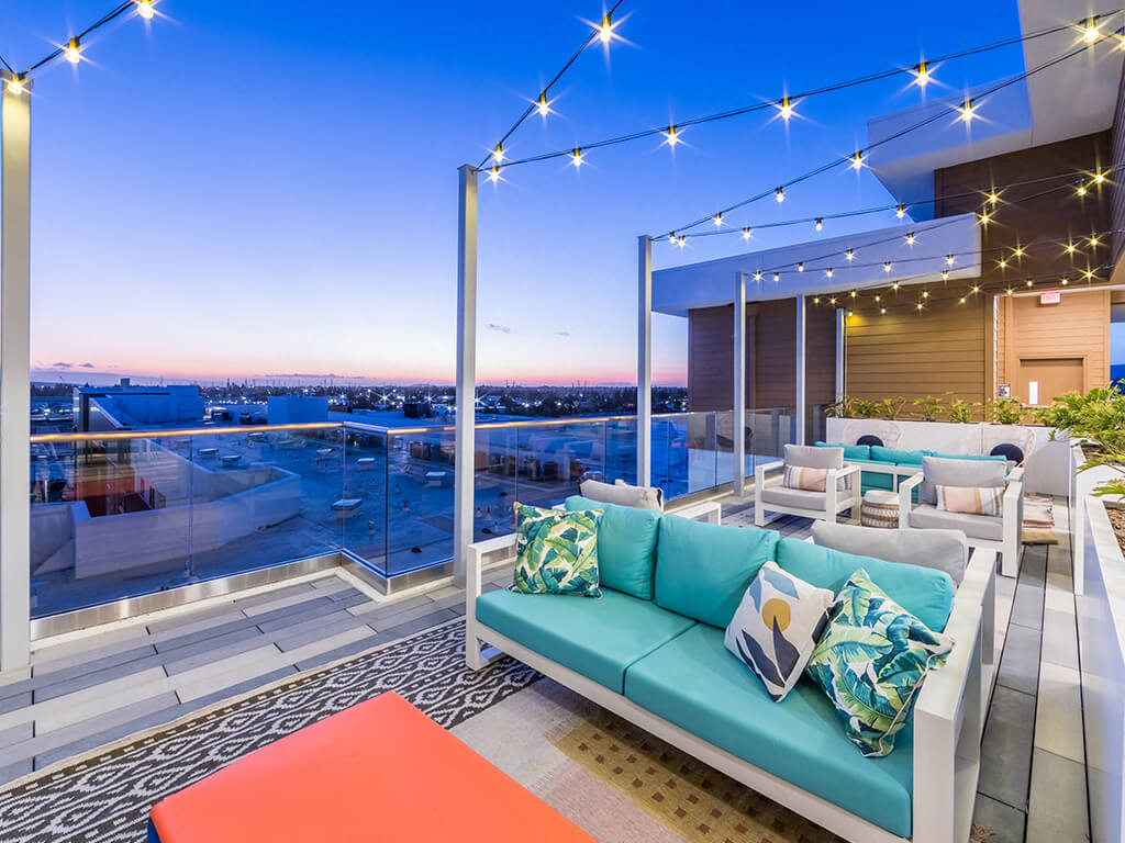 A dining table overlooking the kitchen at the Embark Apartments in Fremont, California.
